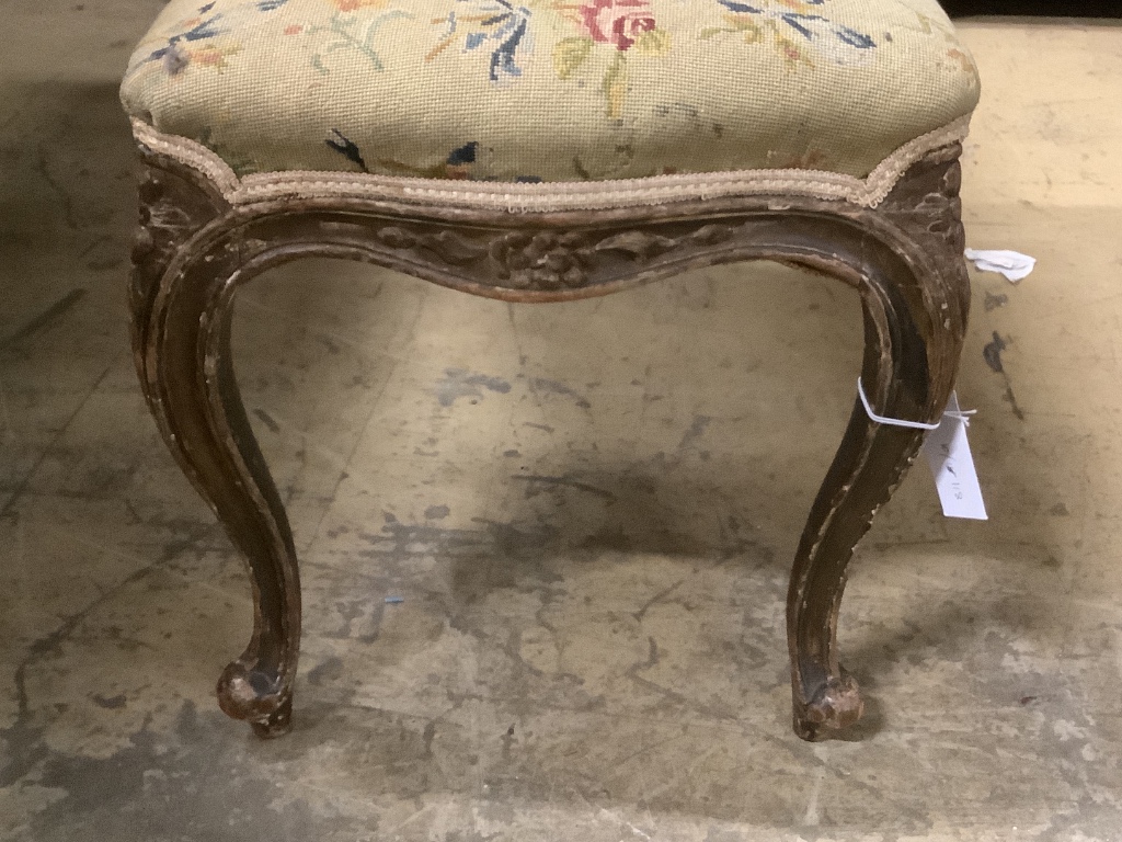 A late Victorian carved and stained beech dressing stool, width 97cm